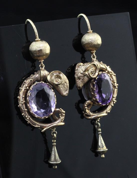 A pair of unmarked gold and amethyst set drop earrings, overall 2in.